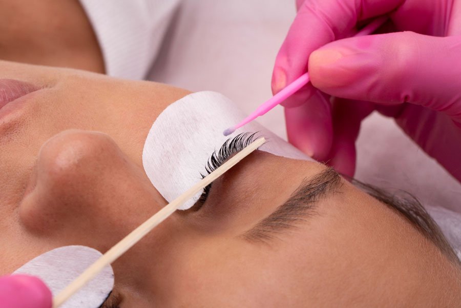 Client undergoing a lash lift procedure at a beauty salon